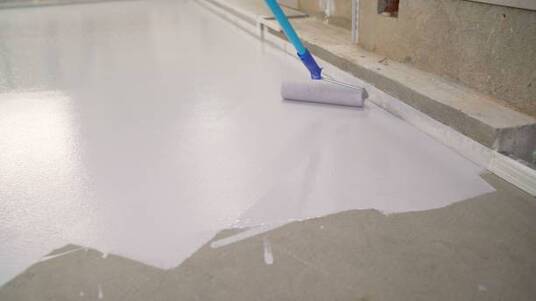 White epoxy coating being installed at an indoor location in Norwalk.